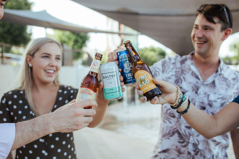 Group of adults drinking different beers together