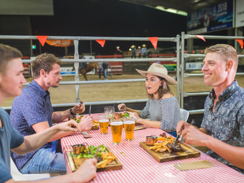 Group of friends eating dinner at the Great Western Hotel