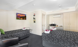 A queen bed and additional single bed for an affordable, accessible stay