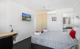 The Executive Queen Room features a 40" smart TV, and a plush Queen bed
